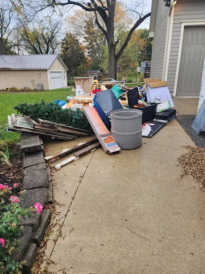 Dumpster being loaded with debris for 3 Yard Dumpster Rental in Vineland